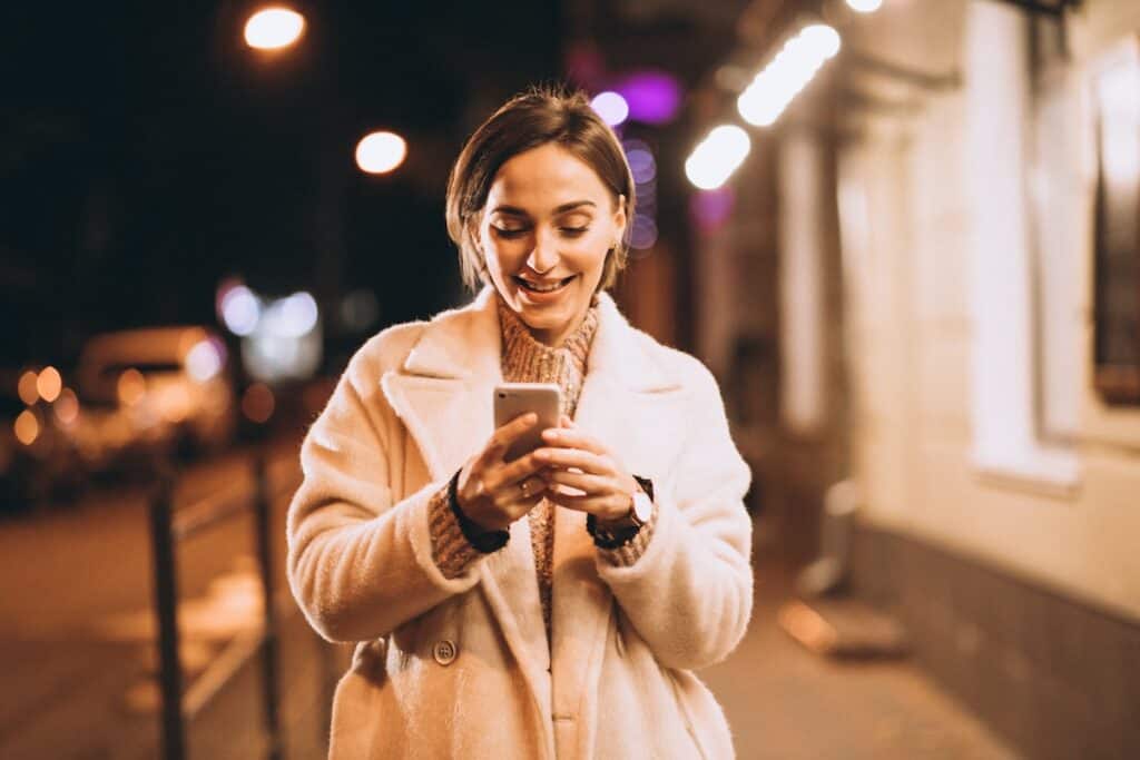 young-woman-using-phone-mobile-messaging